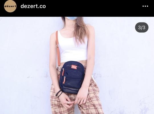Mirror Tiger 入行後創立了自家時裝品牌 Dézert,相中背部正是余潔滢。