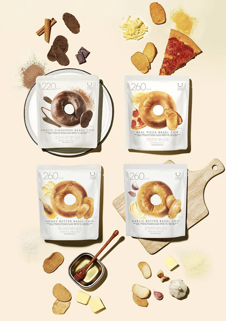 圖中展示的是Delight Project 的貝果餅乾，餅乾切片烤得酥脆，口味眾多，又低卡，是完美的嘴饞小點心。