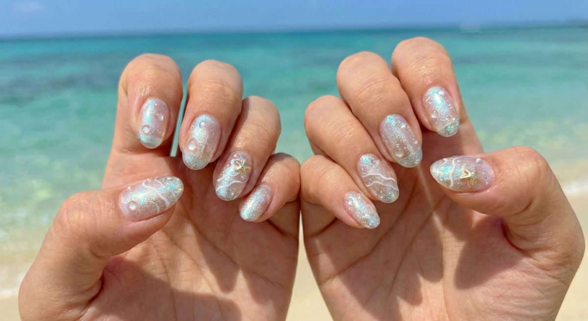 圖中展示的是水波紋極光美甲款式。利用透明的加固膠或造型膠,在甲面上堆疊出如同水滴落入湖面時泛起的層層漣漪。