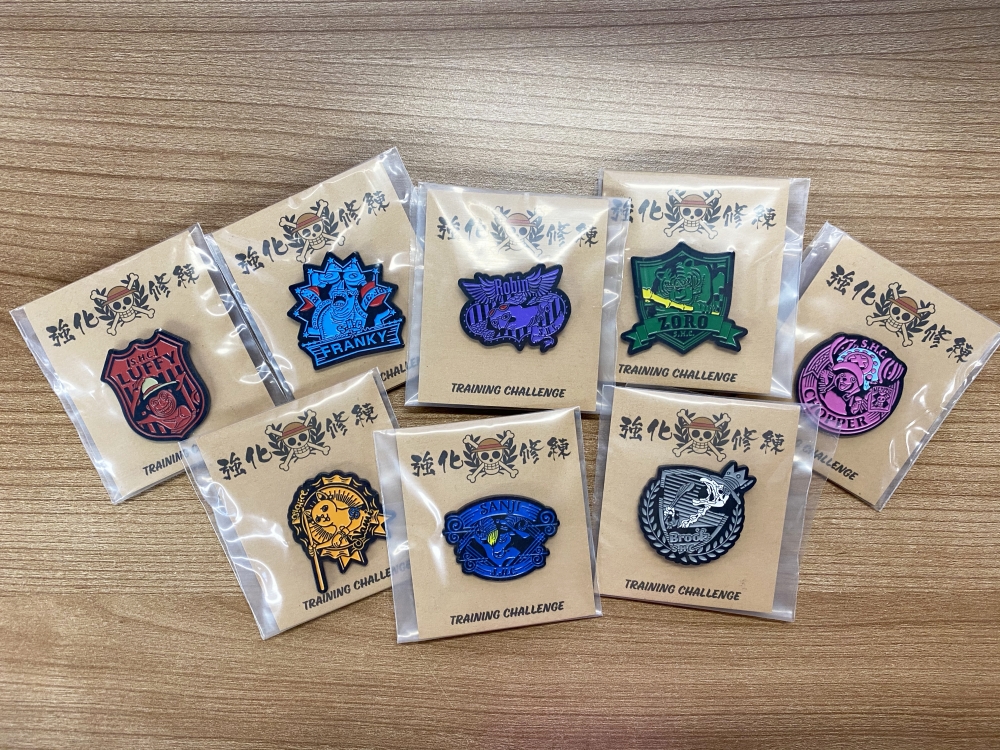  今次活動設計獨家修練裝備包，有齊T恤、毛巾及口罩，全部以灰黑色為主色調，型格十足，還有分別代表草帽小子一伙全員的徽章，絕對極具收藏價值。