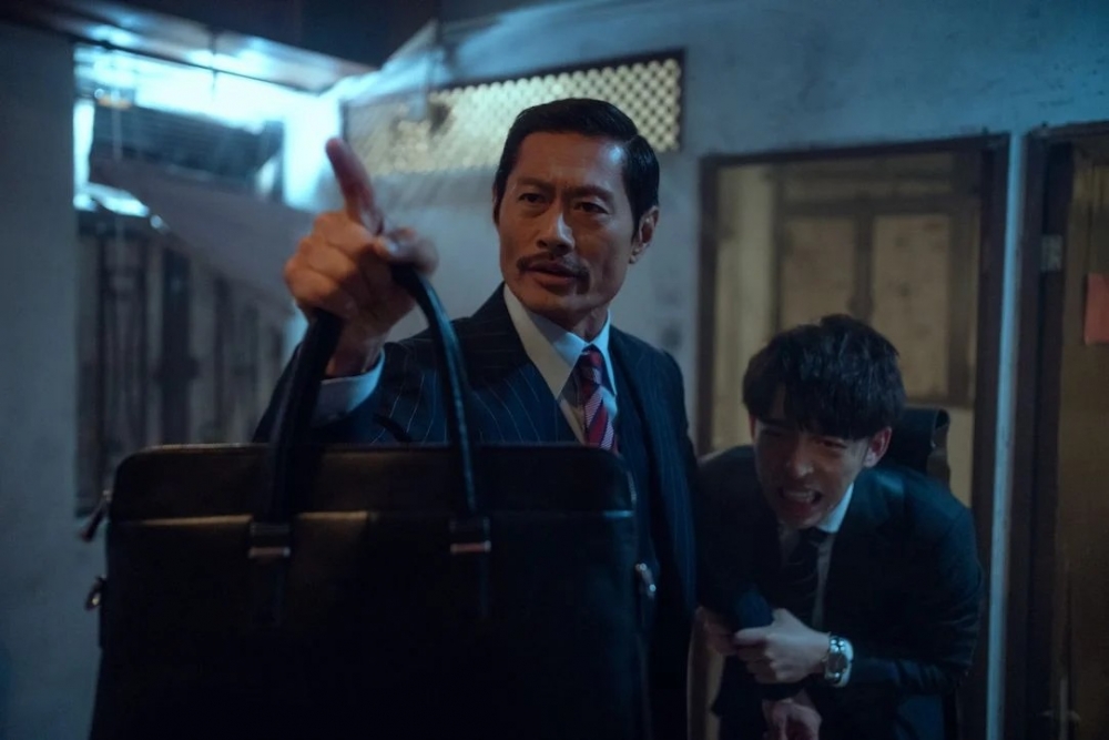 KK雖然內心很害怕，但在阿田面前仍然強裝大膽保護他。