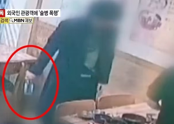 韓男手持酒瓶尾隨台灣觀光客