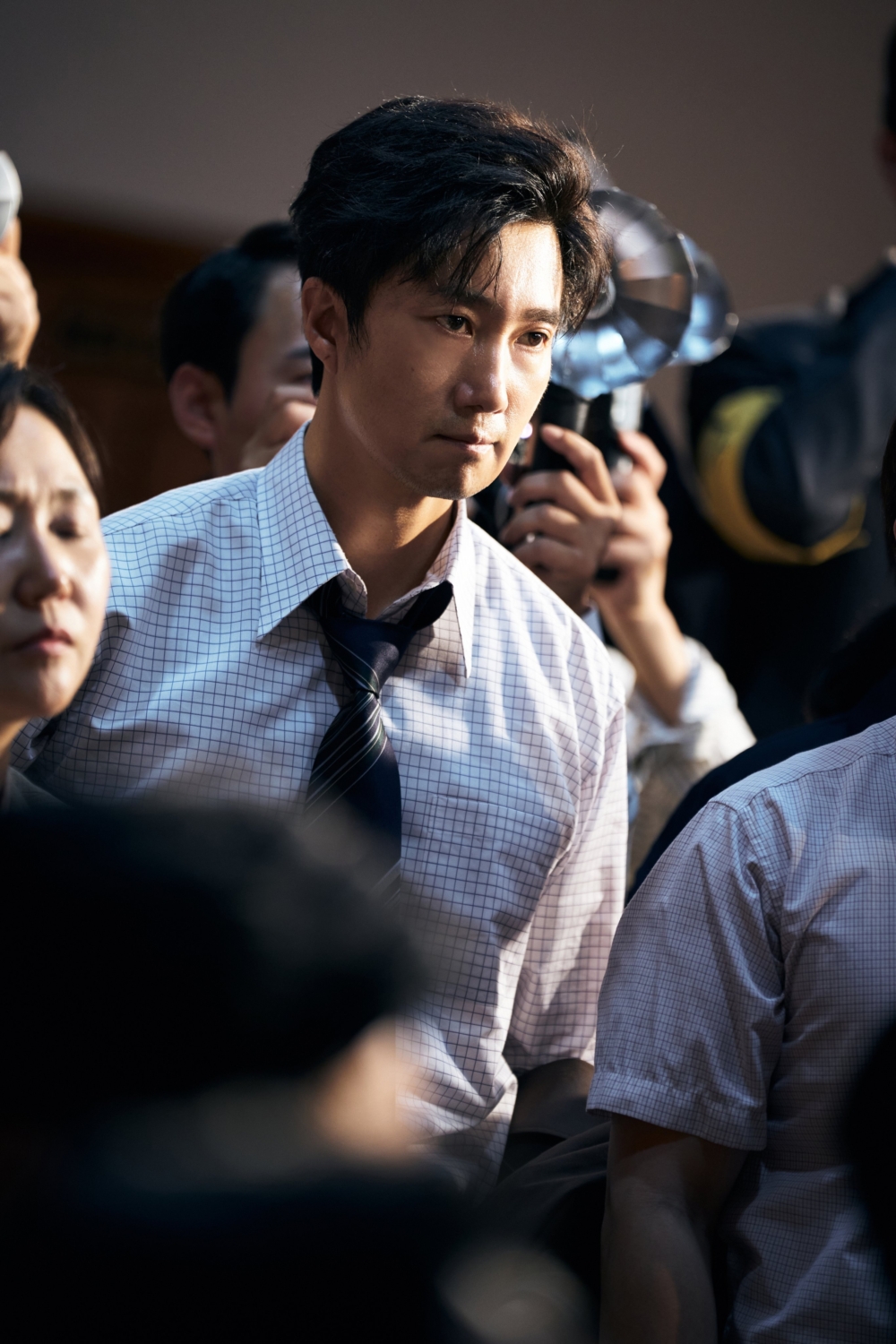 朴海日飾演報社社會部主任